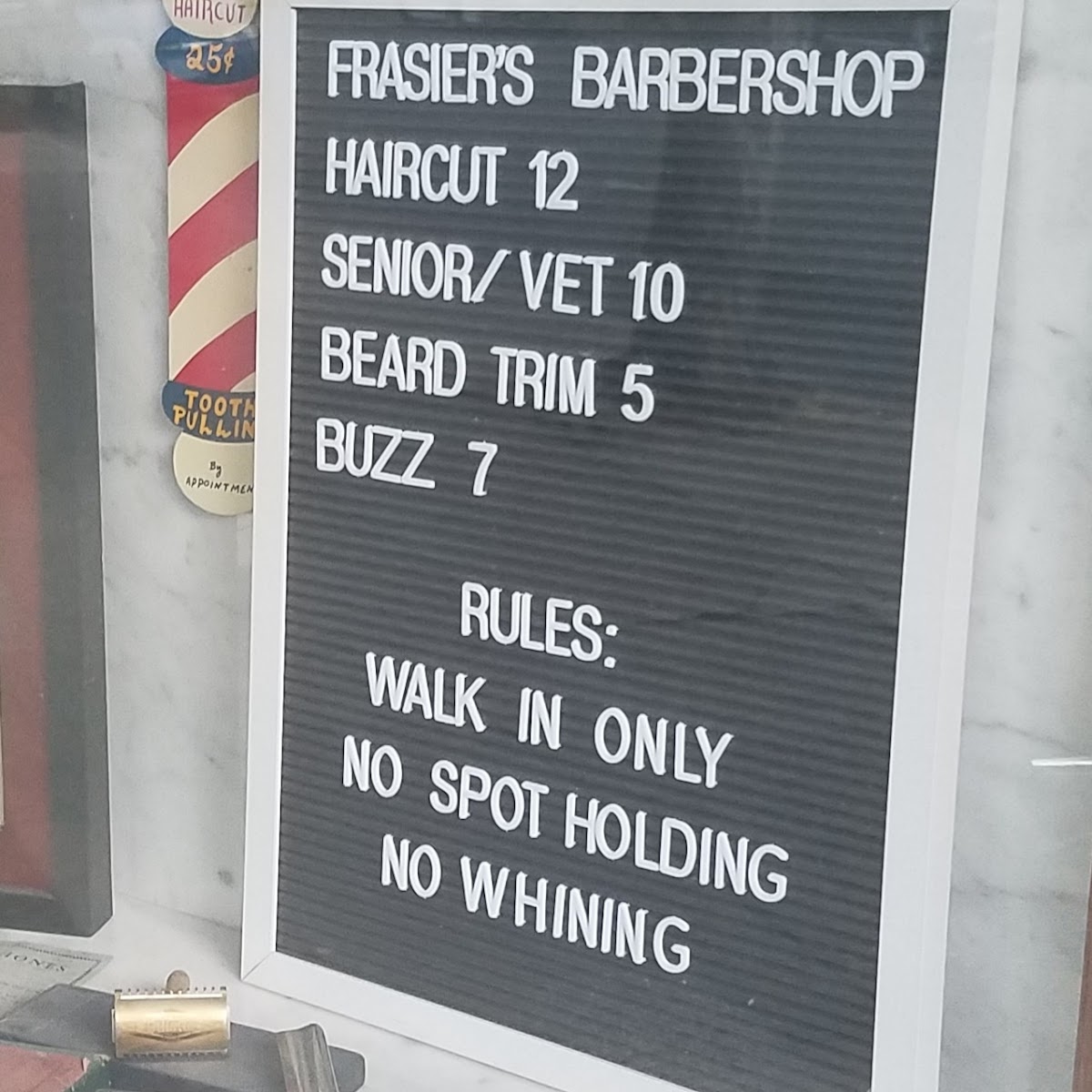 Frasier's Barbershop posted price and house-rules board